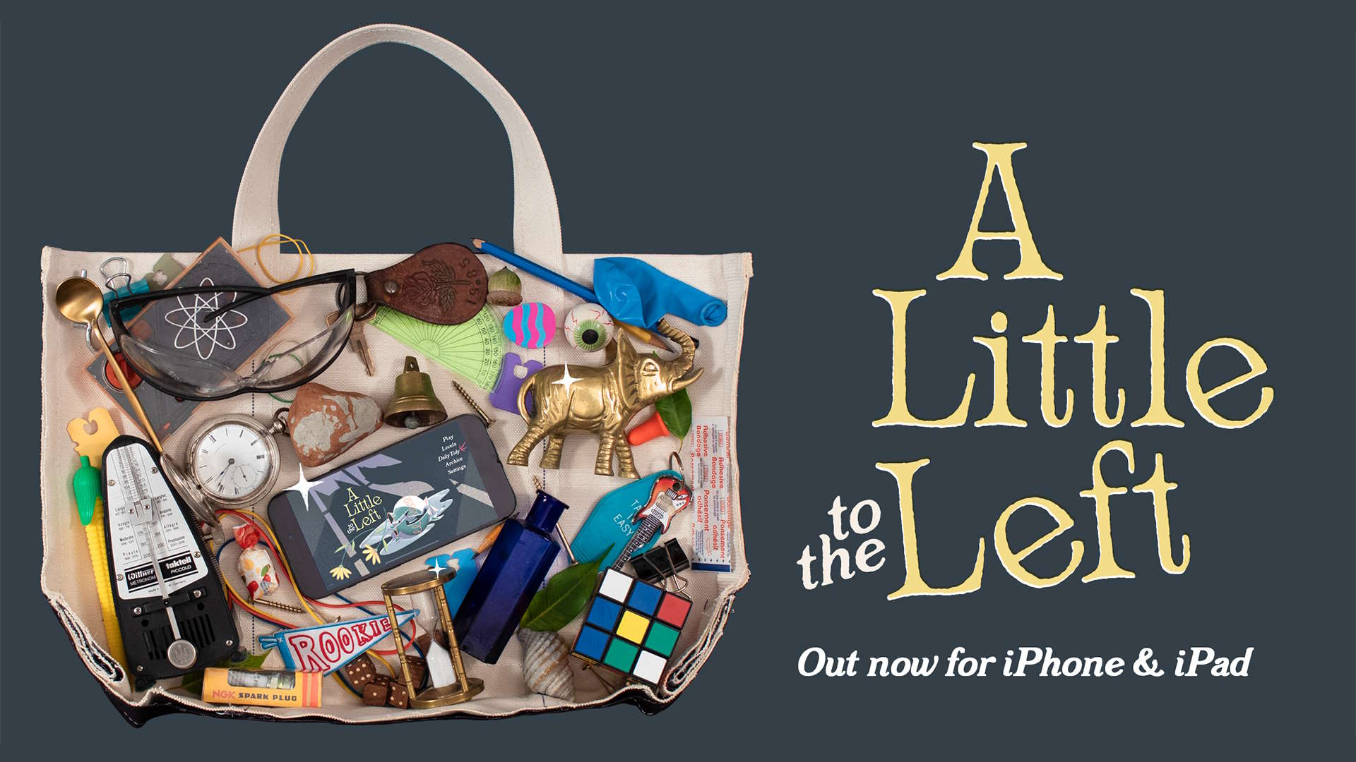 A Little to the Left key art showing a bag full of assorted junk such as a metronome and a puzzle cube, with a mobile phone displaying A Little to the Left in the middle.